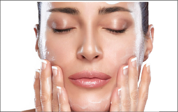 Holistic skincare for healthy aging woman applying moisturizer